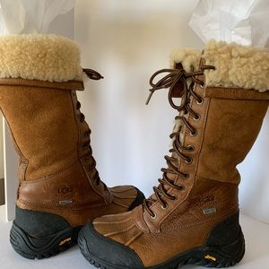 UGG lace up leather boot with waterproof bottom lined with shearling